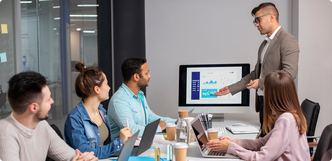 A group people reading information in a meeeting