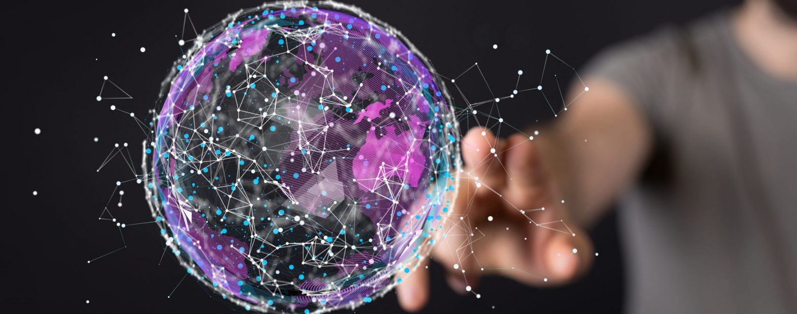 a hand touching a globe
